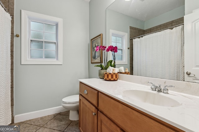 bathroom with toilet, tile patterned flooring, a shower with curtain, and vanity