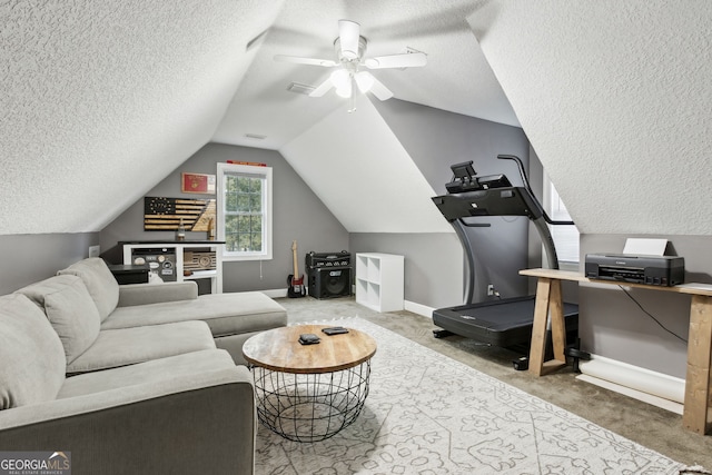 workout room featuring vaulted ceiling, a textured ceiling, ceiling fan, and carpet