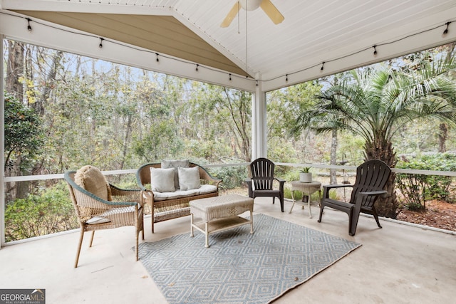 sunroom featuring vaulted ceiling and ceiling fan