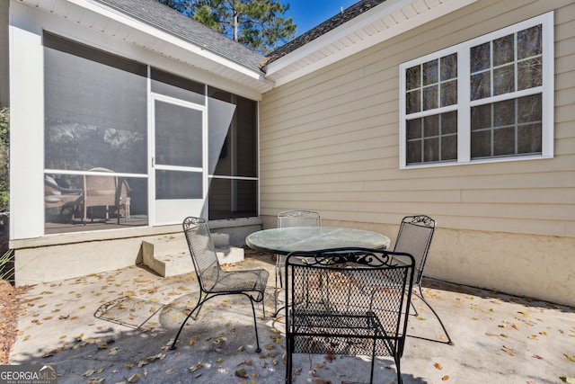 view of patio / terrace with a sunroom