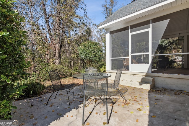 view of patio / terrace with a sunroom