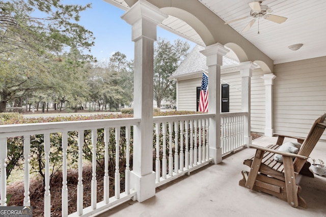 balcony with a porch and ceiling fan