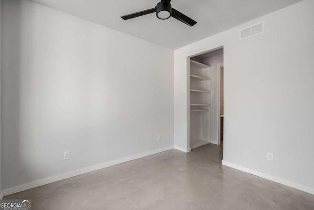 spare room featuring concrete flooring and ceiling fan