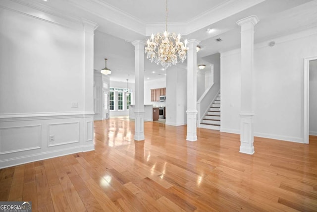 22 Lazy Hammock Ct, Savannah, GA 31419 - unfurnished living room featuring a notable chandelier, light hardwood / wood-style flooring, and ornamental molding