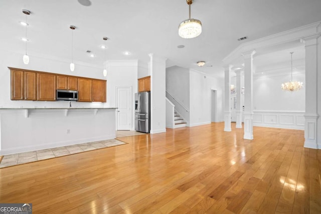 22 Lazy Hammock Ct, Savannah, GA 31419 - unfurnished living room with a chandelier, light wood-type flooring, and ornamental molding
