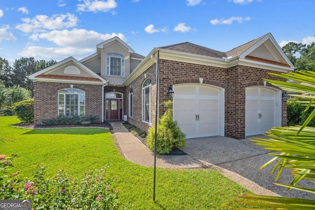 view of front of house with a garage and a front yard