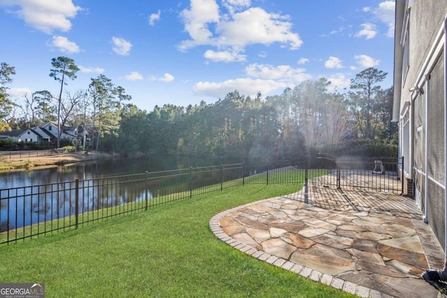 view of yard featuring a patio area and a water view