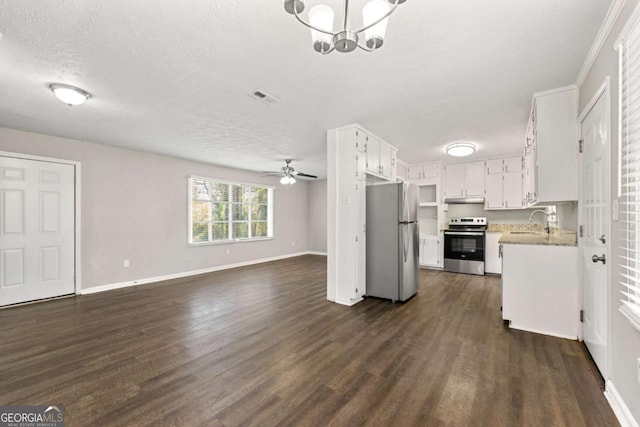 kitchen with a textured ceiling, dark hardwood / wood-style flooring, white cabinets, appliances with stainless steel finishes, and sink