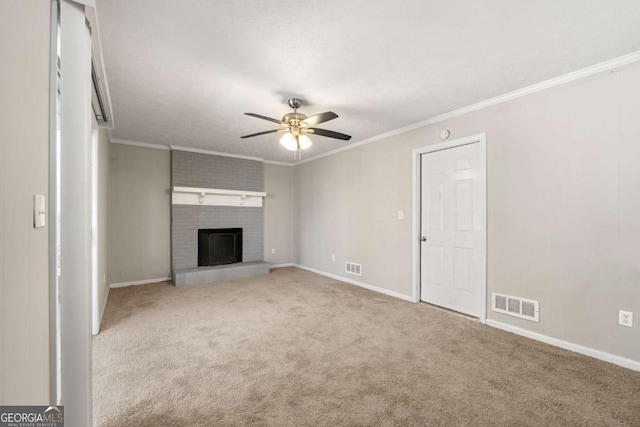 unfurnished living room featuring ceiling fan, light colored carpet, crown molding, and a fireplace