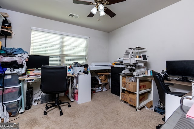 office featuring ceiling fan and light carpet