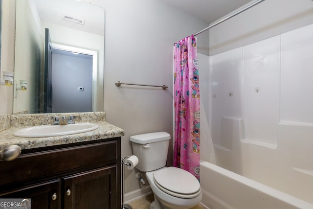 full bathroom featuring toilet, vanity, and shower / bath combo with shower curtain