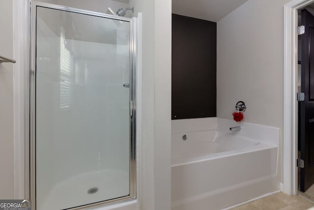 bathroom with shower with separate bathtub