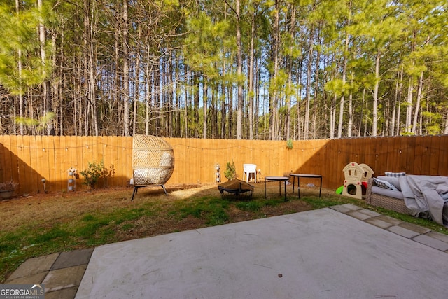 view of patio featuring a fire pit