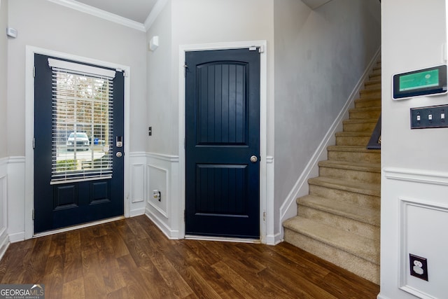 entryway with crown molding and dark hardwood / wood-style floors