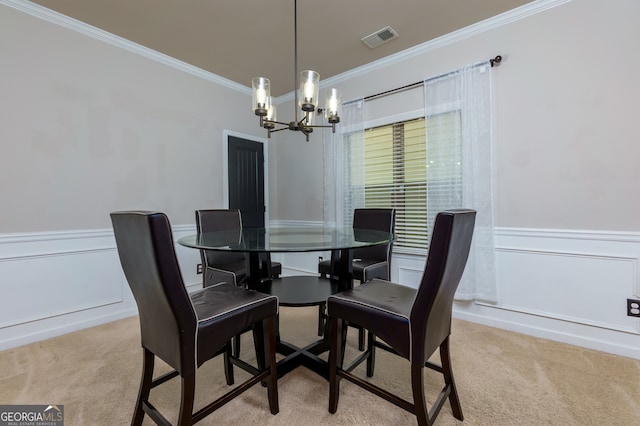 dining area featuring light carpet, a chandelier, and ornamental molding