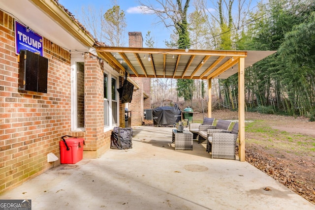 view of patio / terrace featuring area for grilling and an outdoor living space