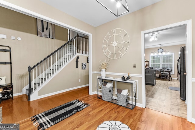 entrance foyer featuring a chandelier and hardwood / wood-style flooring