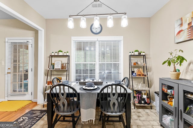 dining room featuring track lighting