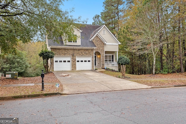 view of front property with a garage and covered porch