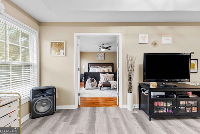 interior space with multiple windows and light hardwood / wood-style floors