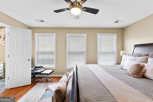 bedroom featuring ceiling fan and light hardwood / wood-style floors