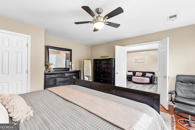 bedroom featuring ceiling fan and hardwood / wood-style floors