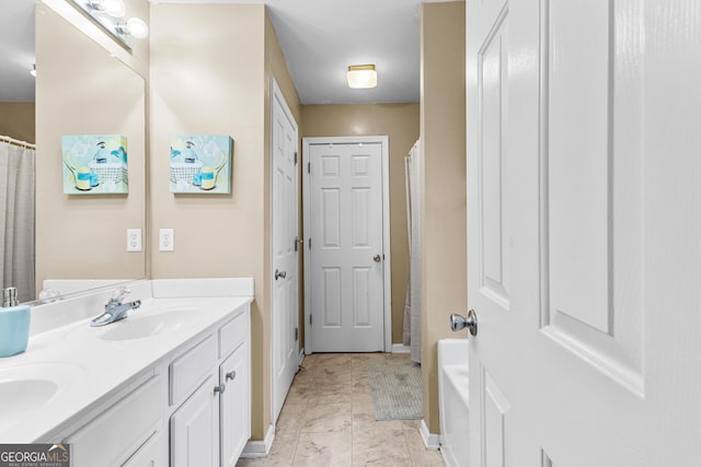 bathroom with vanity and tile patterned flooring