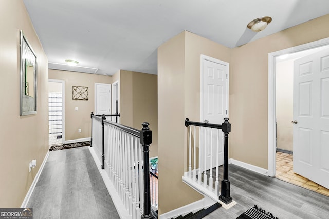 corridor featuring hardwood / wood-style flooring