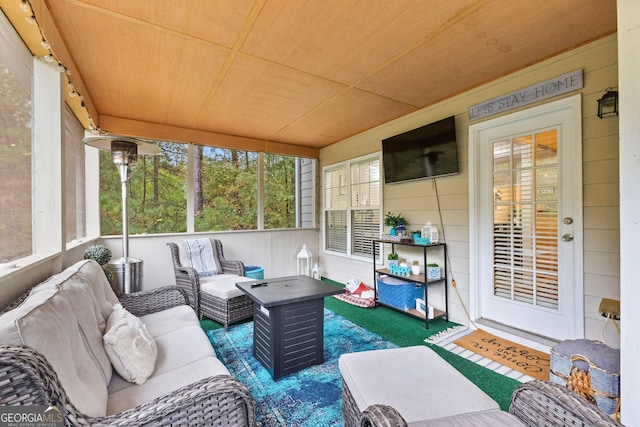 sunroom / solarium featuring wood ceiling