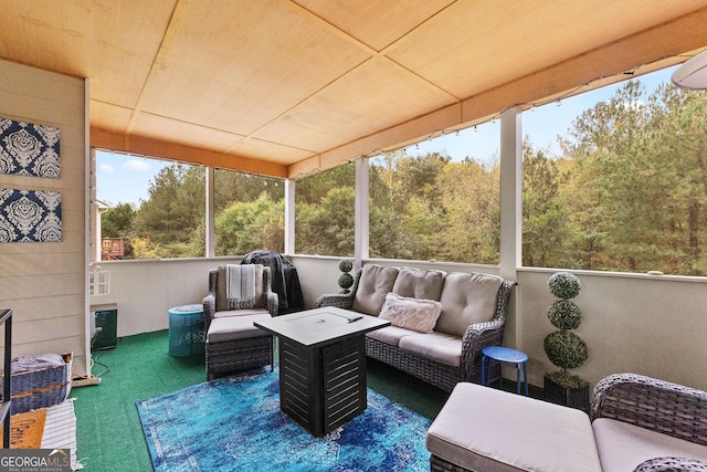 sunroom / solarium with wood ceiling and plenty of natural light