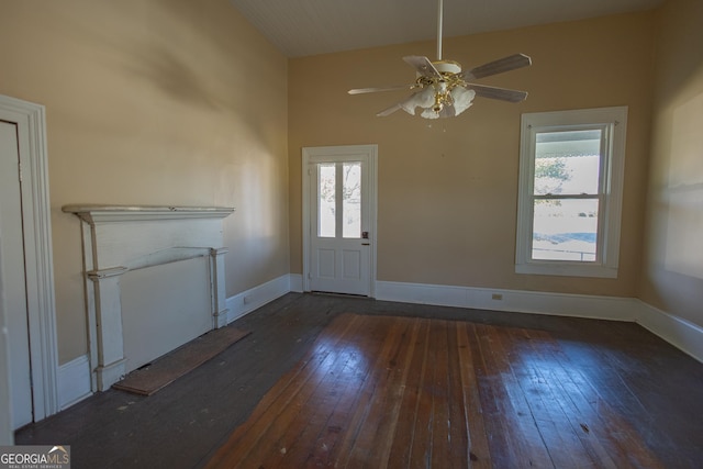 foyer featuring vaulted ceiling, dark wood-type flooring, and ceiling fan