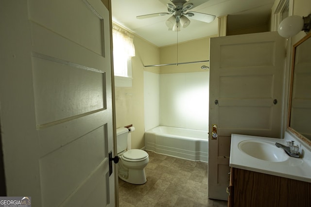 full bathroom with toilet, ceiling fan, washtub / shower combination, and vanity