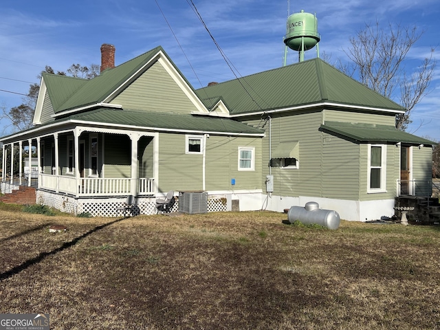 exterior space featuring covered porch and cooling unit