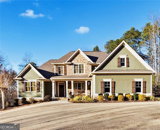 craftsman-style home with covered porch