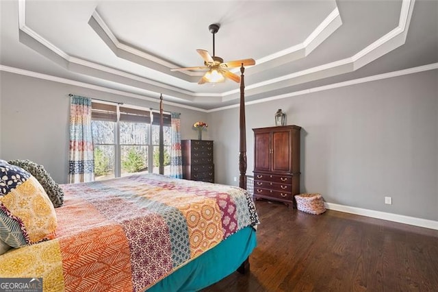 bedroom with ceiling fan, crown molding, a raised ceiling, and dark wood-type flooring