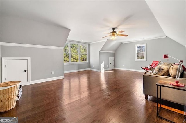 bonus room with lofted ceiling, ceiling fan, and dark wood-type flooring