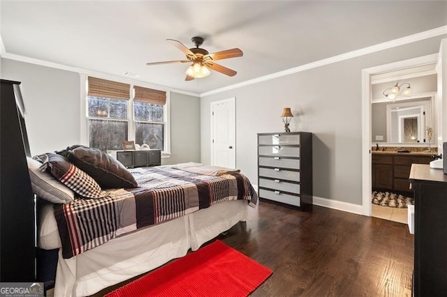 bedroom with dark wood-type flooring, ceiling fan, crown molding, and ensuite bathroom