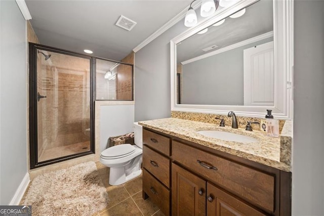 bathroom featuring a shower with door, crown molding, vanity, and toilet