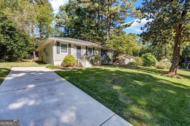 ranch-style home with a front yard