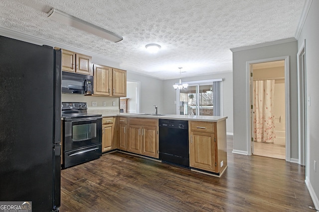 kitchen with decorative light fixtures, a textured ceiling, ornamental molding, kitchen peninsula, and black appliances