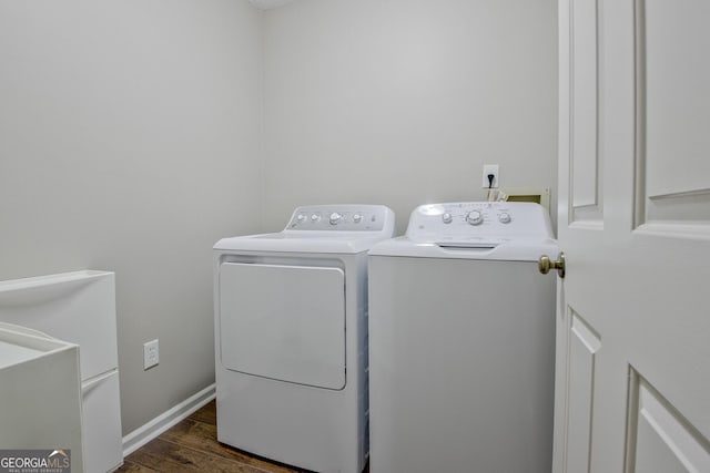 laundry room with dark wood-type flooring and independent washer and dryer