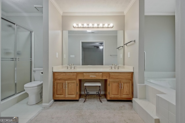 full bathroom featuring toilet, vanity, ceiling fan, independent shower and bath, and a textured ceiling