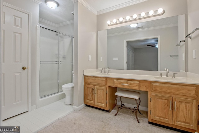 bathroom featuring ceiling fan, ornamental molding, toilet, an enclosed shower, and vanity