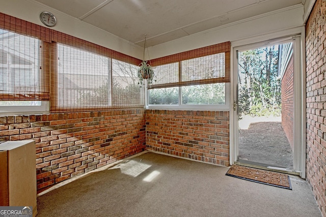 unfurnished sunroom featuring a healthy amount of sunlight