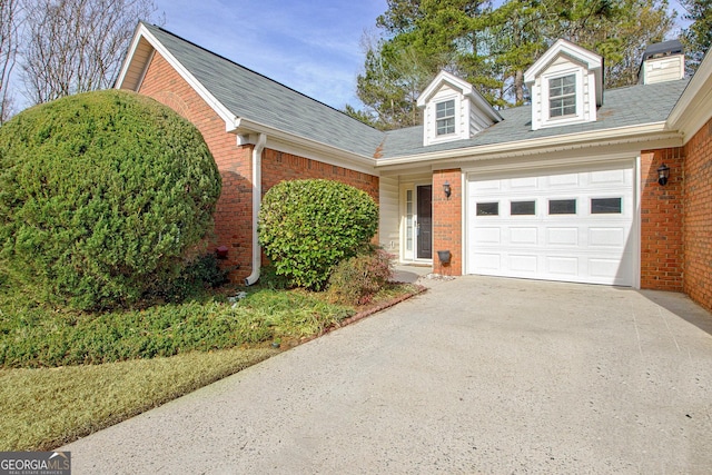 cape cod-style house with a garage