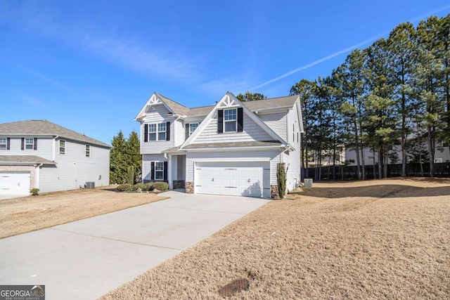 view of front of property featuring central AC unit, a front lawn, and a garage