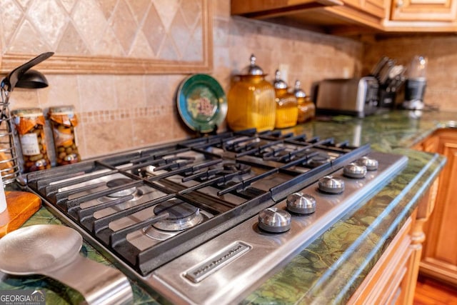 details featuring range and tasteful backsplash