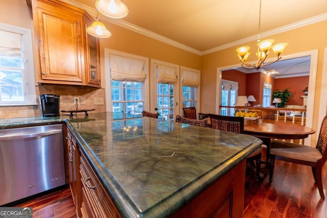 kitchen with stainless steel dishwasher, crown molding, a notable chandelier, and dark wood-type flooring