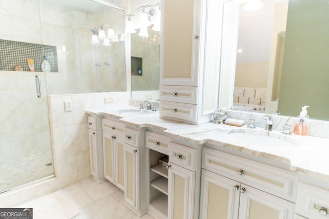 bathroom featuring an enclosed shower and vanity