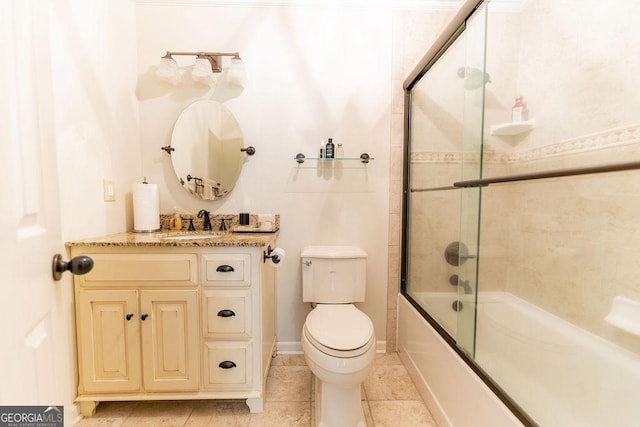 full bathroom with toilet, vanity, tile patterned floors, and combined bath / shower with glass door